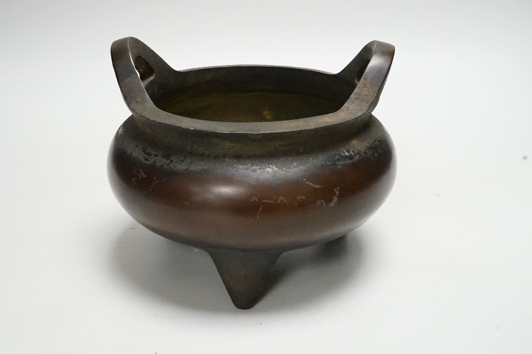 A Chinese bronze censer, ding, 13.5cm tall